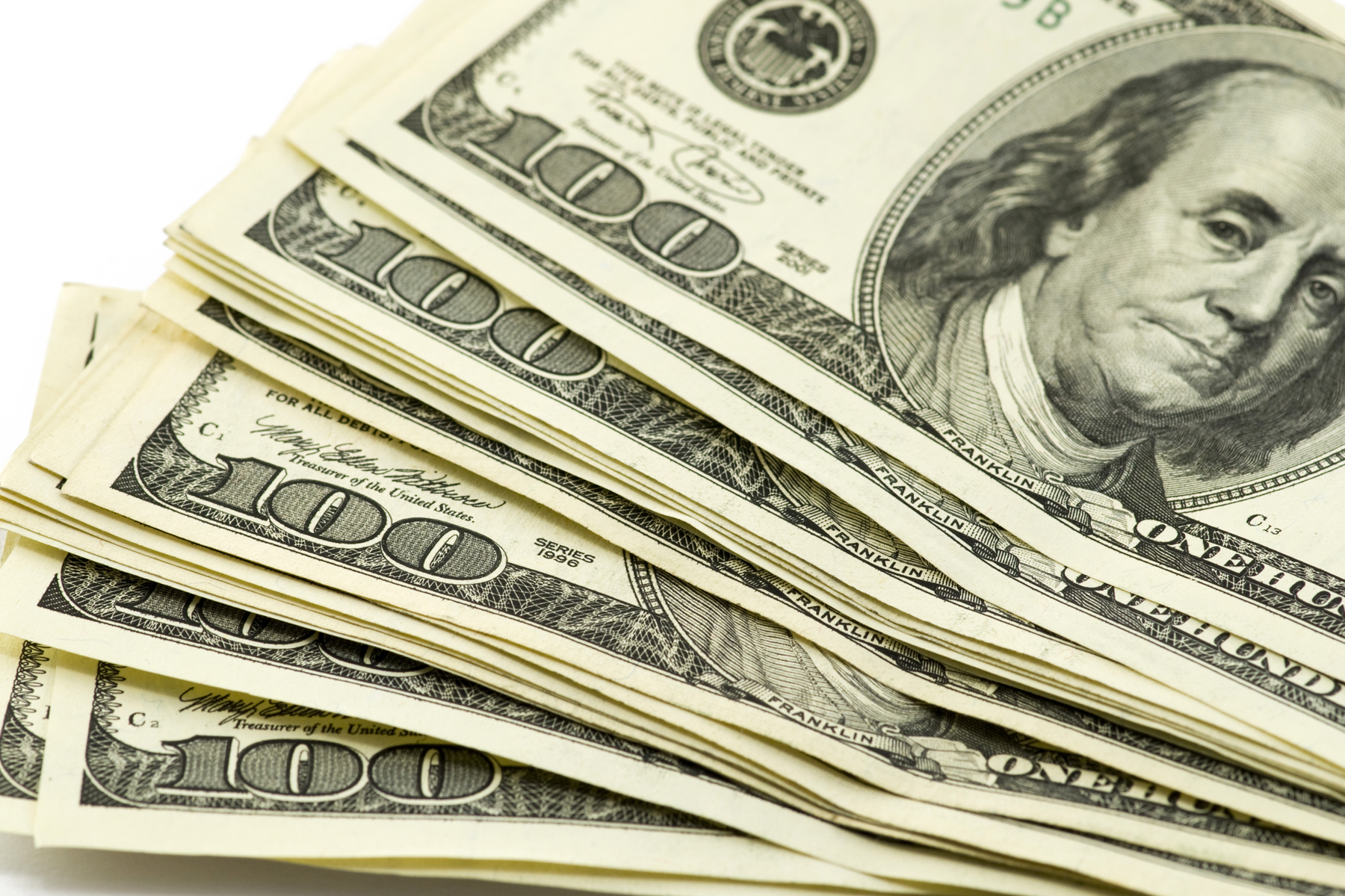 Banner Image: Handful of one hundred dollar bills to represent cashflow at a startup.